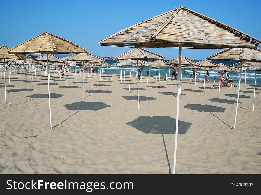 Umbrellas on the sunny beach. Umbrellas on the sunny beach