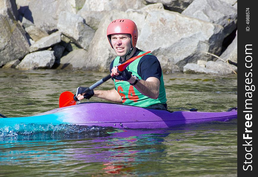 Image of the kayaker with an oar on the water