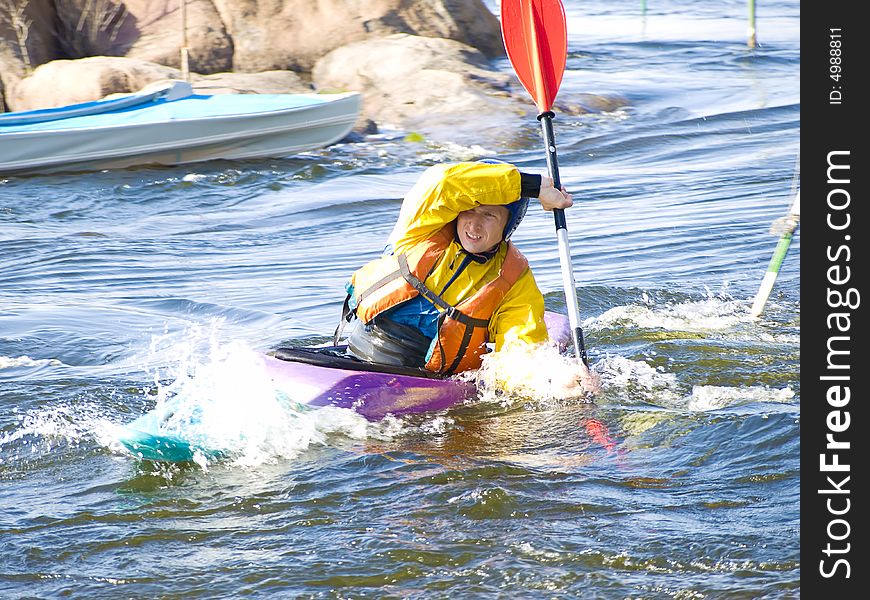 Image of the kayaker with an oar on the water