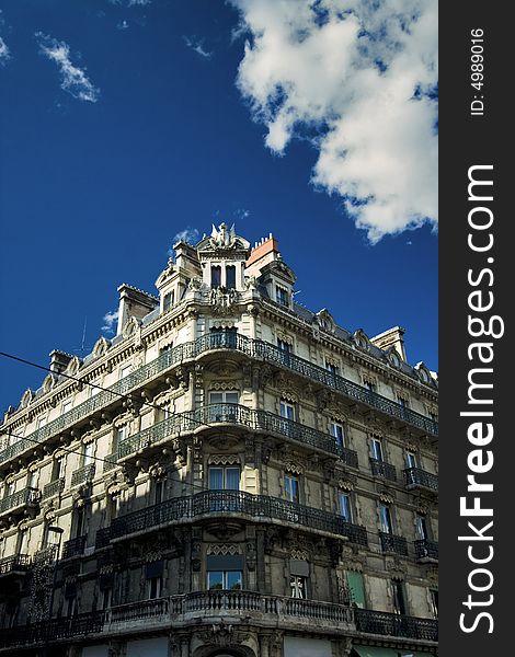 View of a French apartment building corner. Wide angle.