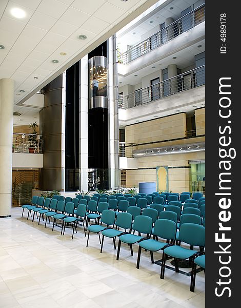 Interior of a contemporary building with seats. Interior of a contemporary building with seats