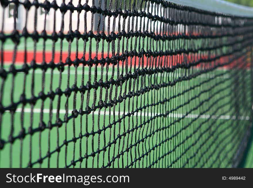 Yellow tennis ball on a green court. Yellow tennis ball on a green court