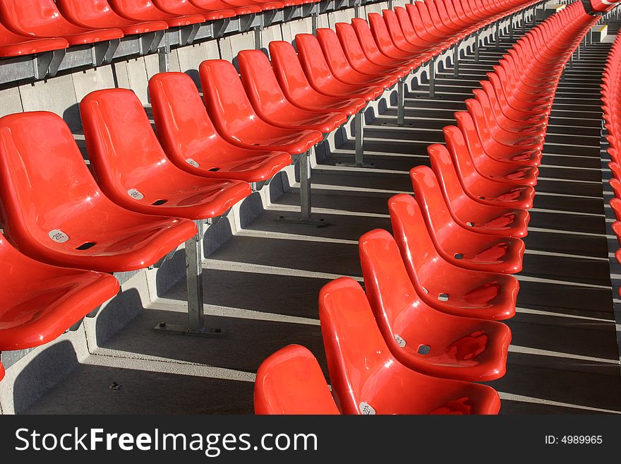 Red seats in a empty stadium. Red seats in a empty stadium