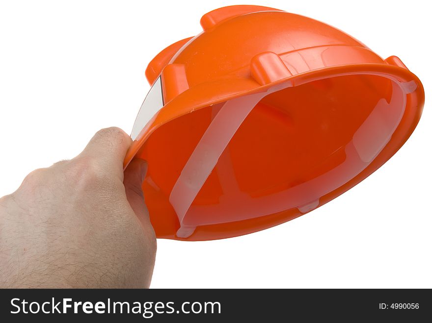 Construction helmet in the man's hand, isolated on the white background