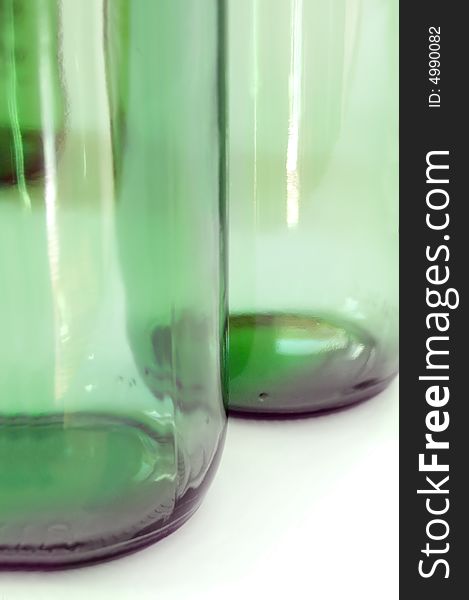 Two green glass bottles on white background. Two green glass bottles on white background