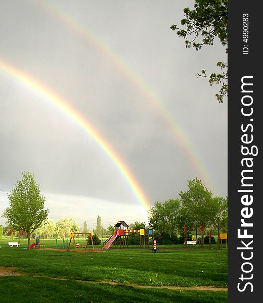 Rainbow appears in the sky after a heavy rain. Rainbow appears in the sky after a heavy rain