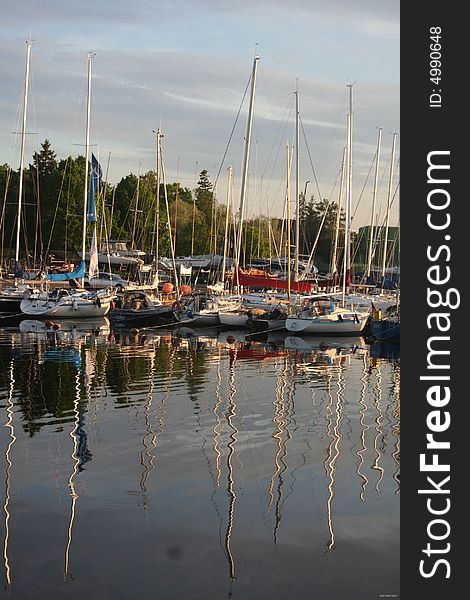 A photo of several yachts staying in harbor. A photo of several yachts staying in harbor.