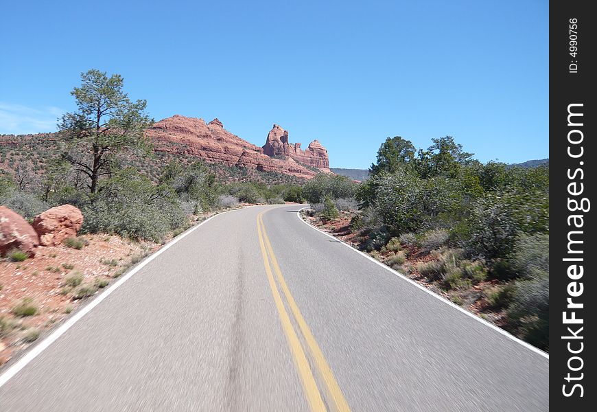 Photograph of the interstate running through beautiful Sedona, AZ landscape. Breathtaking blue sky. Photograph of the interstate running through beautiful Sedona, AZ landscape. Breathtaking blue sky.