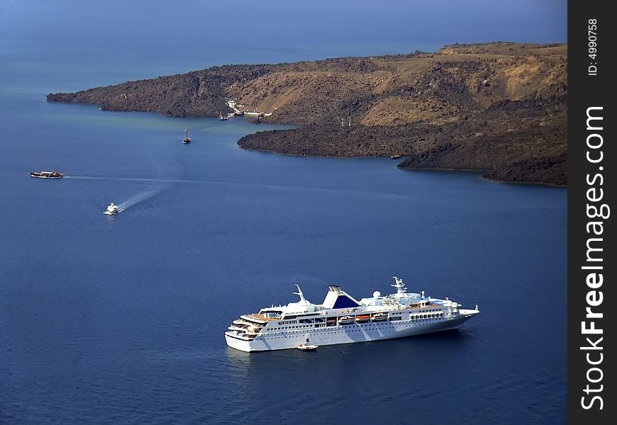 Touristic cruiseship near Santorini in Greece. Touristic cruiseship near Santorini in Greece