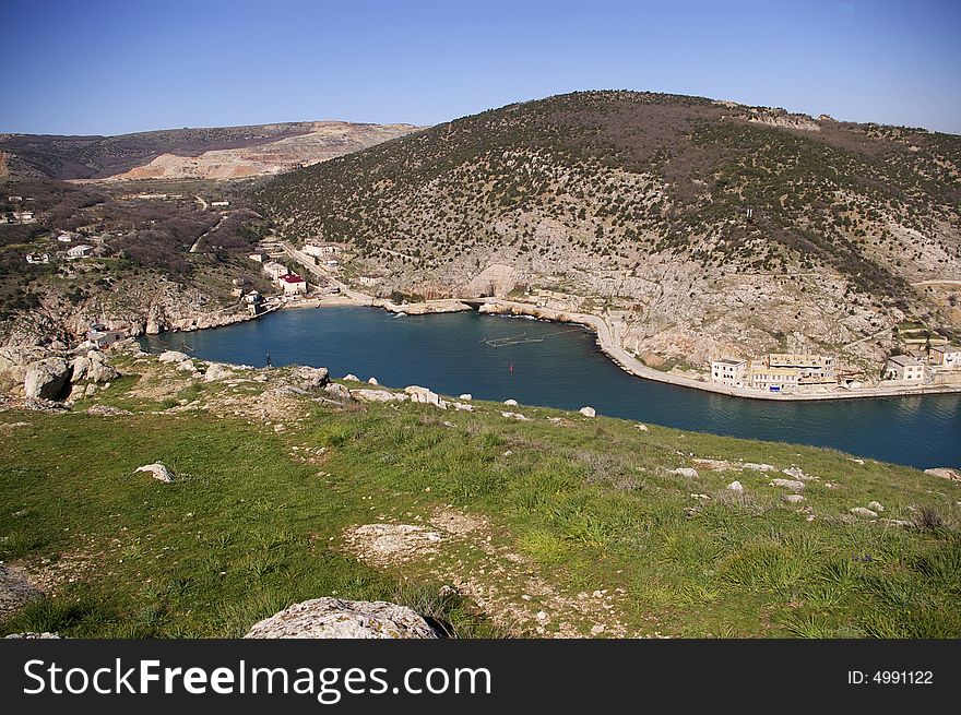 Mountains and a blue gulf at early spring