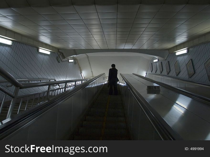 Alone businessman in beijing metro,china