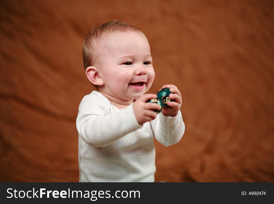 Baby playing with musical zen balls.