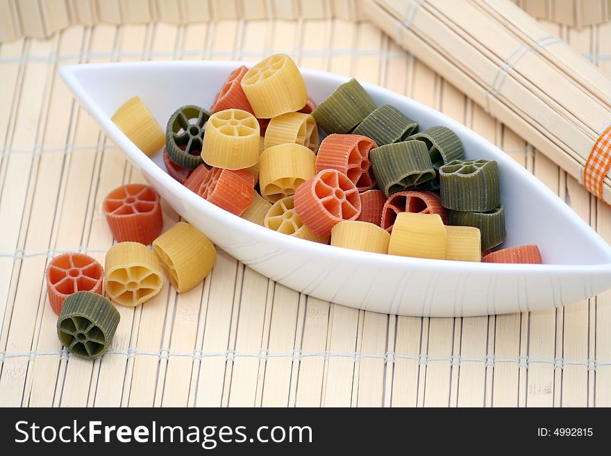 Beautiful table-ware with pasta tricolore