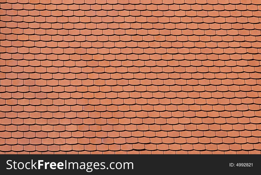 Traditional orange tiles of a newly built house. Traditional orange tiles of a newly built house