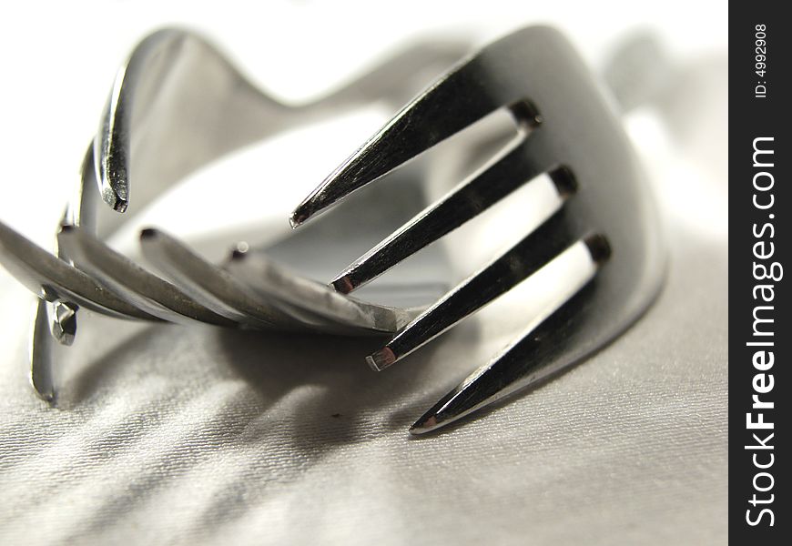 Three metal silver forks isolated closeup