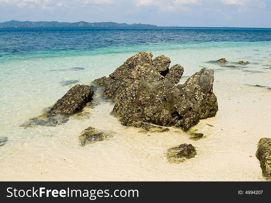 Stones coastline at Phi Phi Don island beach, Thailand