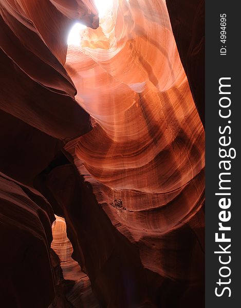 A ray of sunlight cast into Antelope Canyon, Page, Arizona