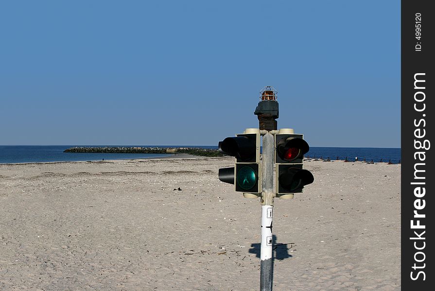 Traffic light at a beach of the german north sea island Helgoland Düne next to the Airfield