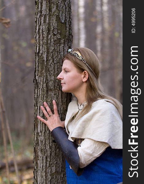 Portrait of the romantic girl in autumn forest. Portrait of the romantic girl in autumn forest