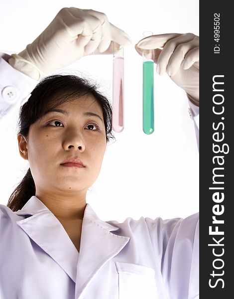 Female scientist with test tube in white background.