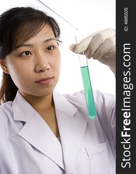 Female scientist with test tube in white background.