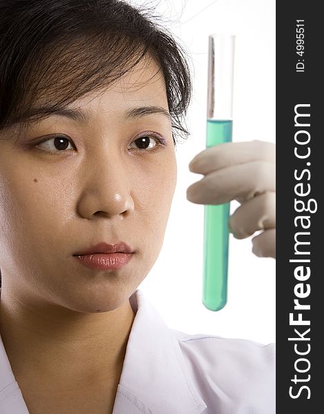 Female scientist with test tube in white background.