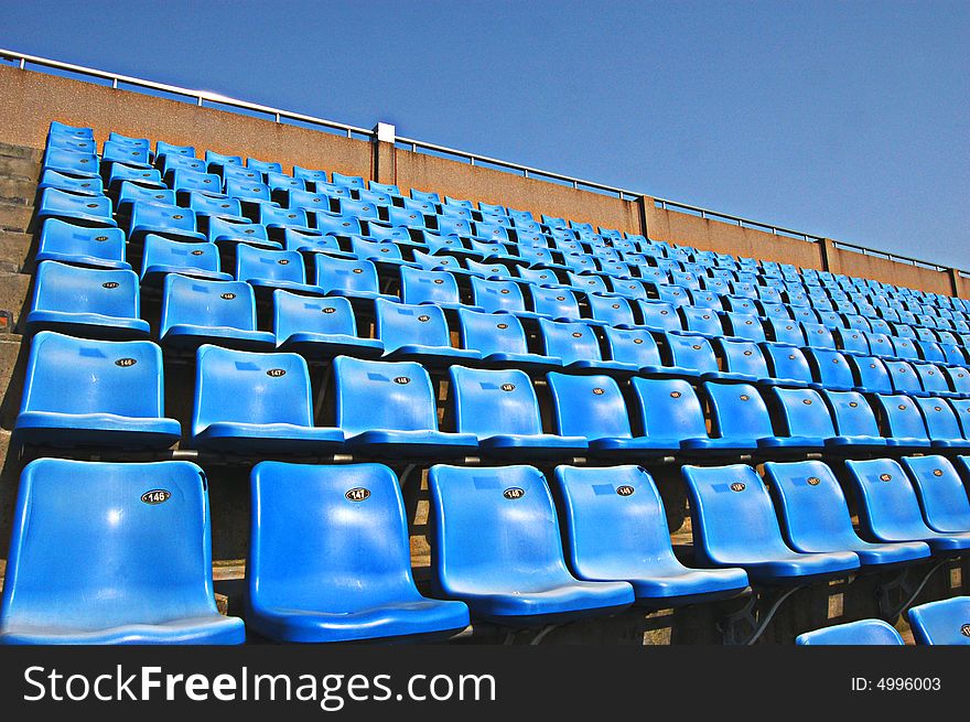 This is can hold over ten thousand person of spectator seats, the neat stool and the blue sky give you the very comfortable feeling