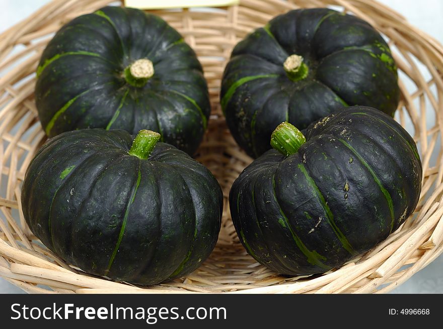 Fresh little pumpkins in basket. Fresh little pumpkins in basket