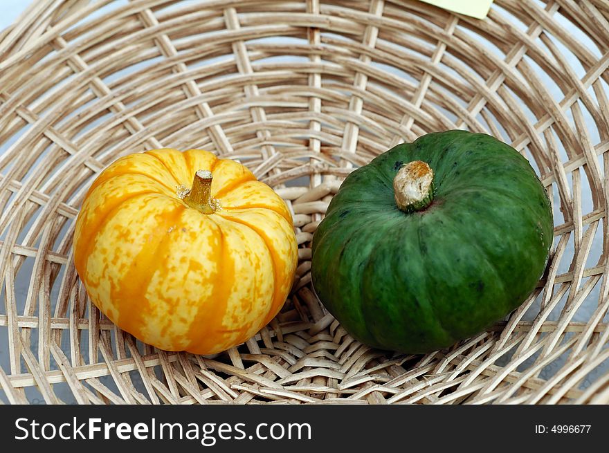 Fresh little pumpkins in basket. Fresh little pumpkins in basket