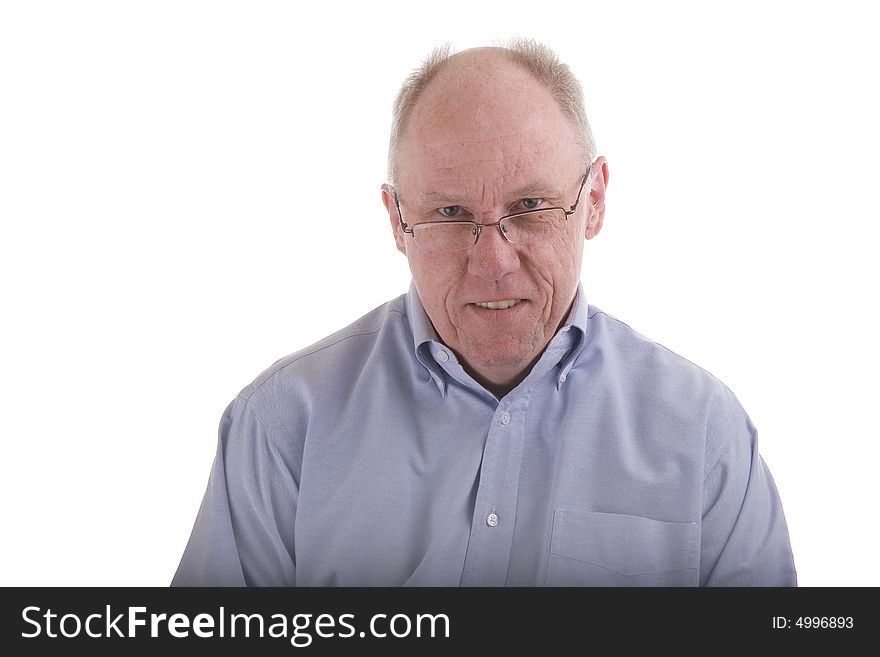 An older guy in a blue dress shirt and reading glasses. An older guy in a blue dress shirt and reading glasses