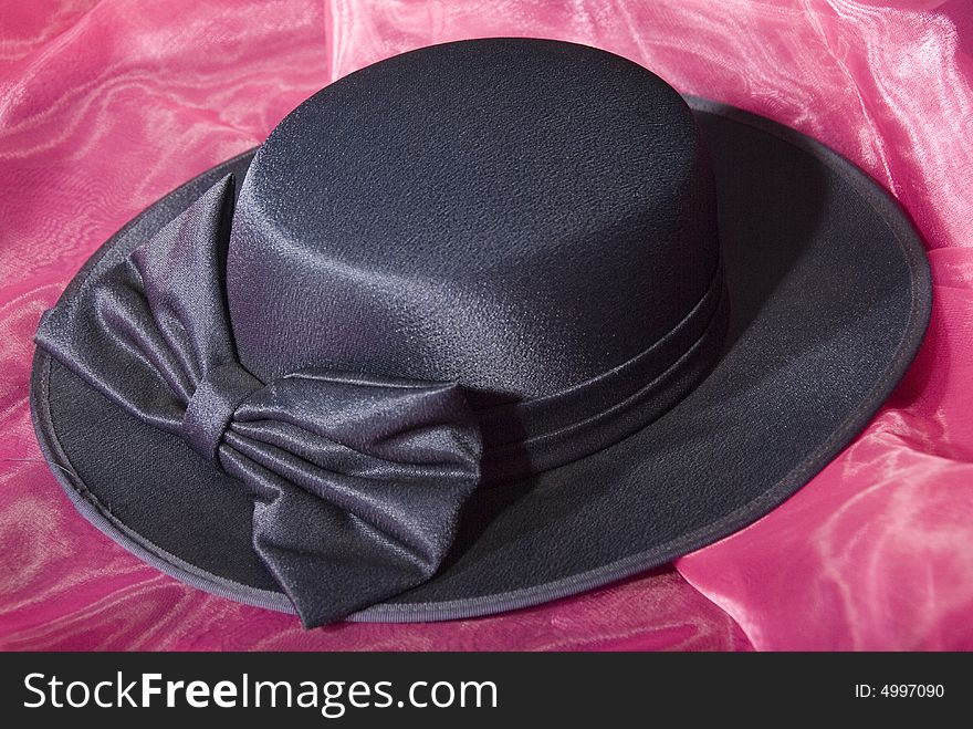 Dark blue ladies dress hat with ribbon