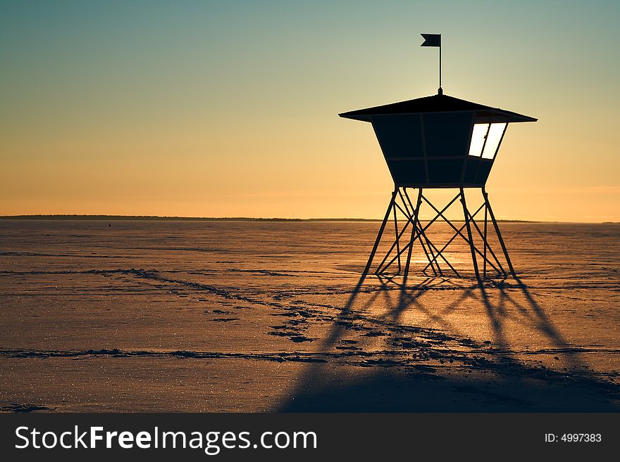 Life guard s hut during sunset in winter