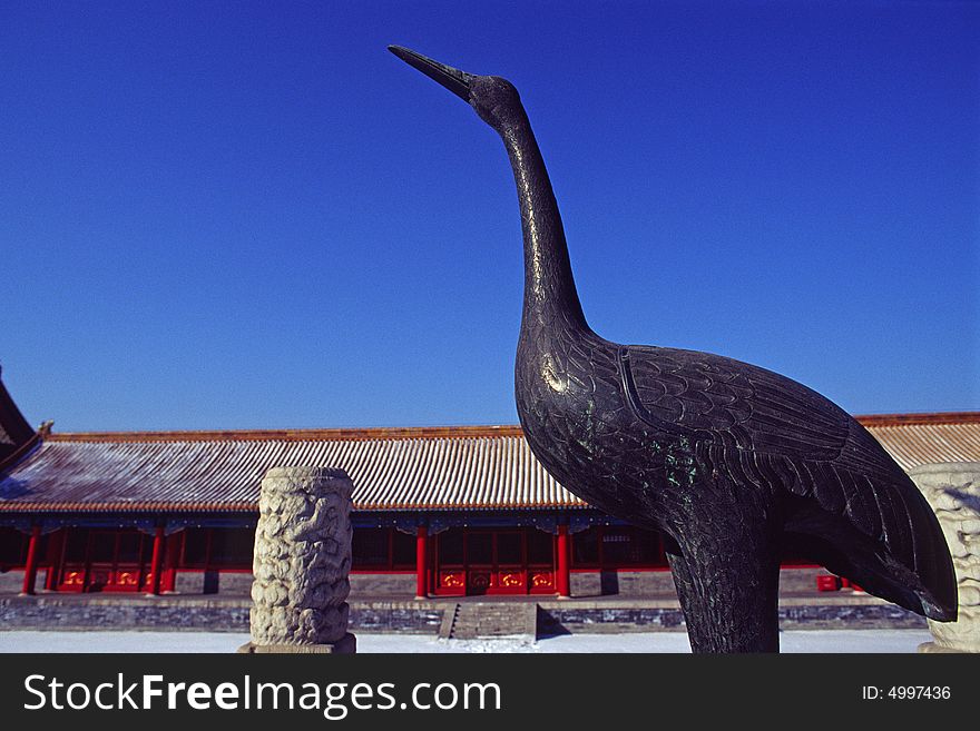 Bronze crane in front of a hall of the forbidden city, beijing, china