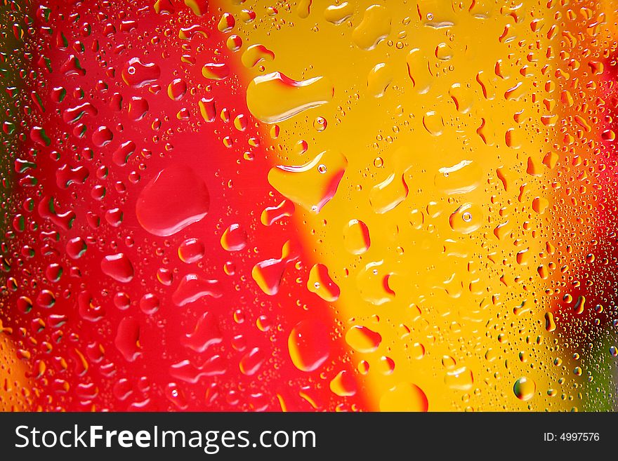 Drops on a red-yellow background. In the middle Drop-heart.
