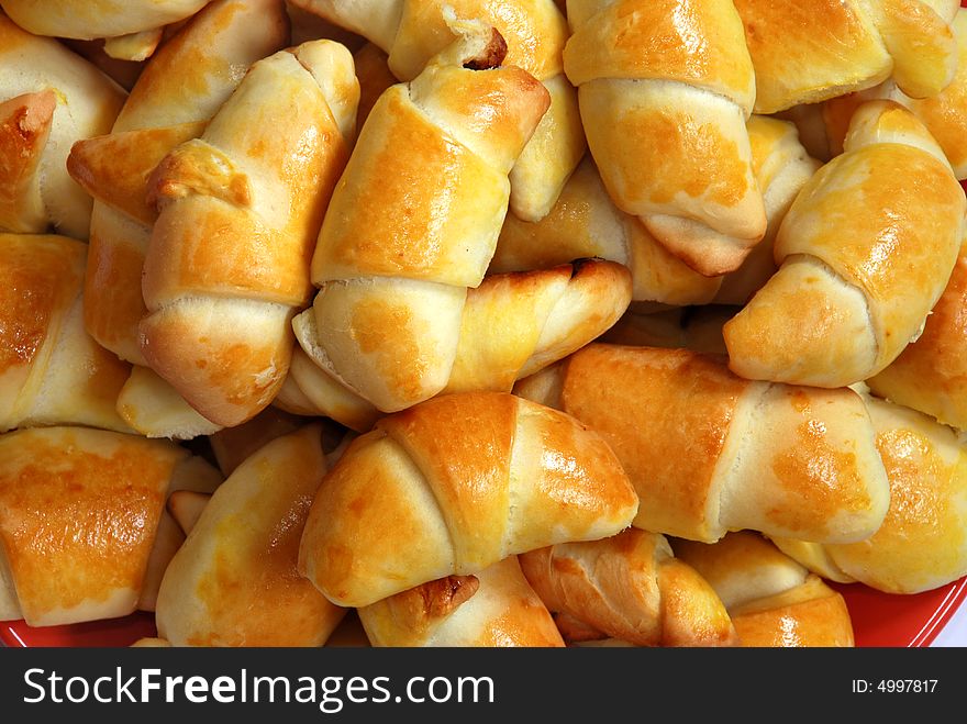 Backed rolled pastry on heap close-up. Backed rolled pastry on heap close-up