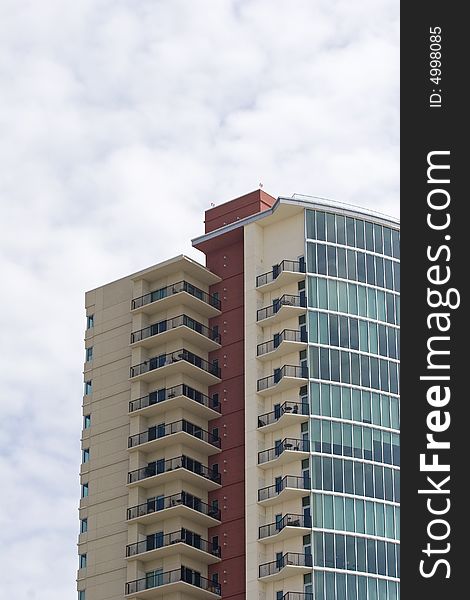 A modern high rise condo building of red white and blue. A modern high rise condo building of red white and blue