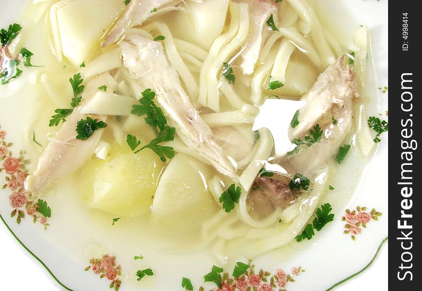 Hot chicken soup bouillon in white dish. Hot chicken soup bouillon in white dish