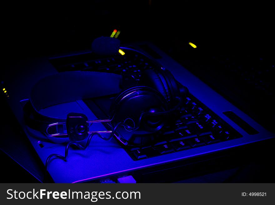 Keyboard and phones in ultra-violet rays