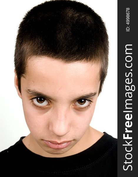 Teenage boy with big brown eyes looking sad