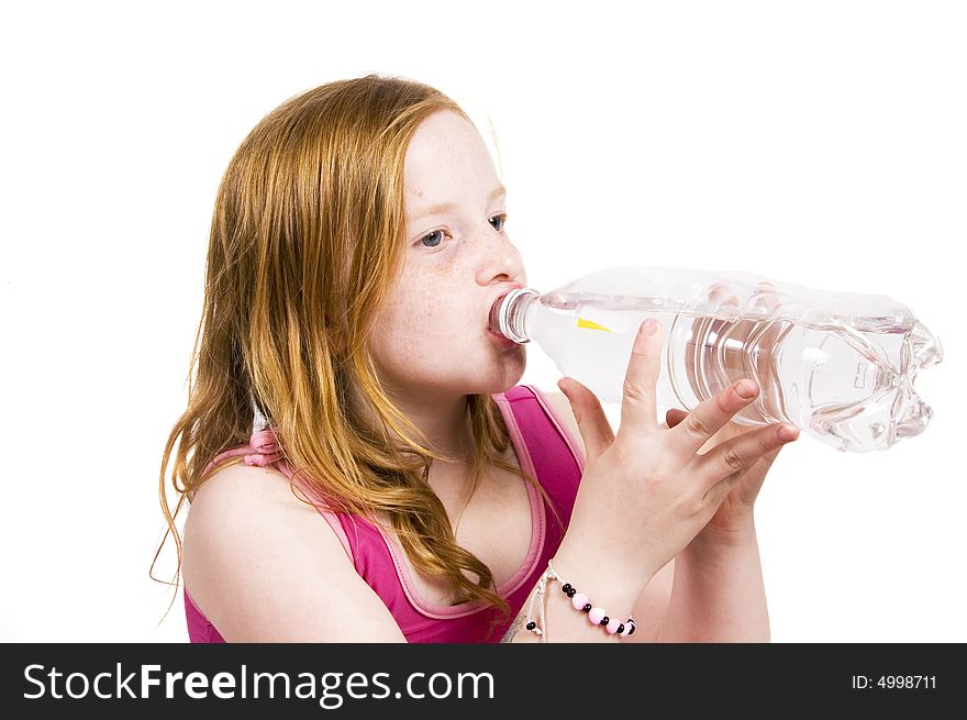 Portrait of a little young girl drinking water