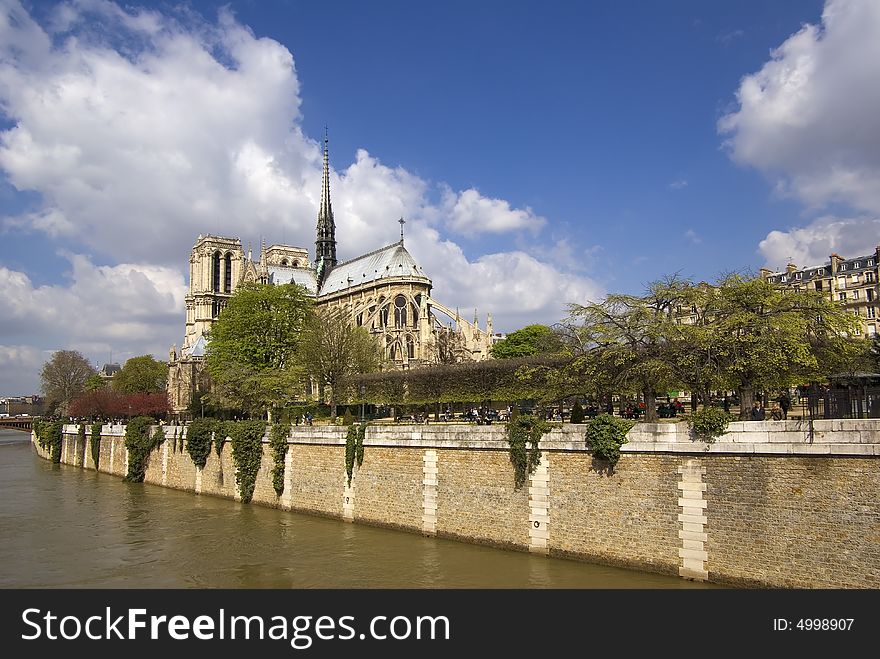 Notre Dame Cathedral with the Seine in the foreground on a sunny Spring day. Notre Dame Cathedral with the Seine in the foreground on a sunny Spring day.