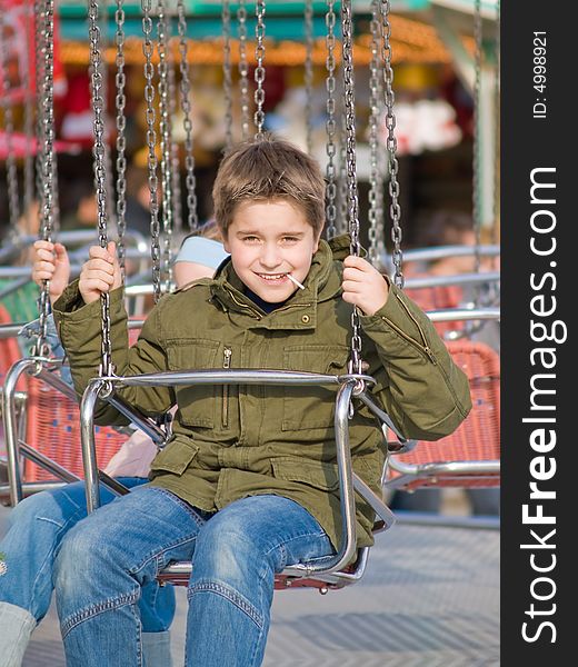 Happy Boy On Carousel