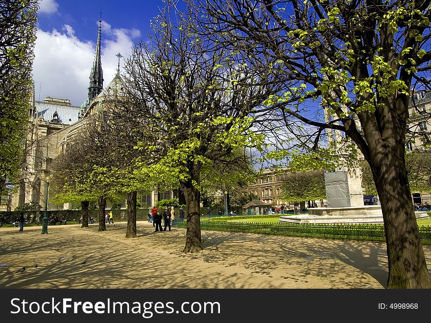 Notre Dame with Spring foliage on a Sunny April day. Notre Dame with Spring foliage on a Sunny April day.