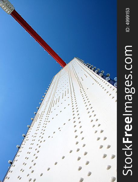 Bold white & red colours of Chelsea Bridge structure against a deep blue sky. Bold white & red colours of Chelsea Bridge structure against a deep blue sky.