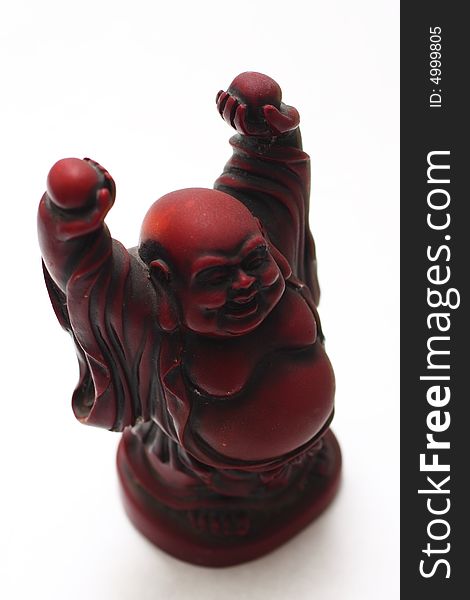 Isolated shot of red buddha statue on white background