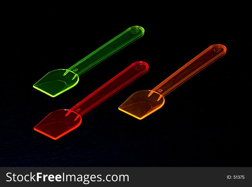 Three coloured spoons for ice cream. Three coloured spoons for ice cream