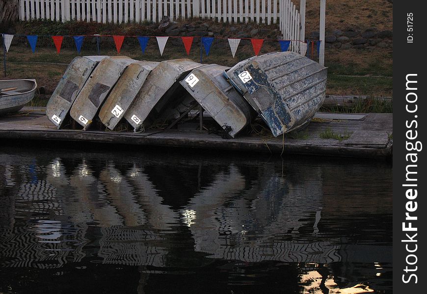 Boats stacked in a row on the boat dock