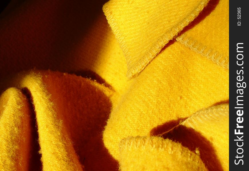 detail of a yellow plaid on a sofa