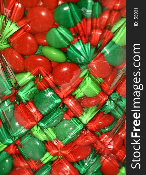 Green and Red candy close up in a decorative glass jar. Green and Red candy close up in a decorative glass jar