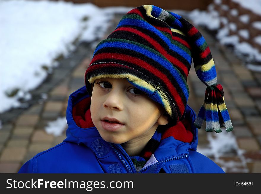 Photo of Child Wearing Jacket and Hat. Photo of Child Wearing Jacket and Hat